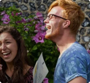 Image of two students laughing