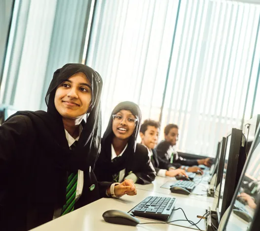 Students sat at computer desks