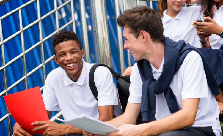 Student friends sat together laughing