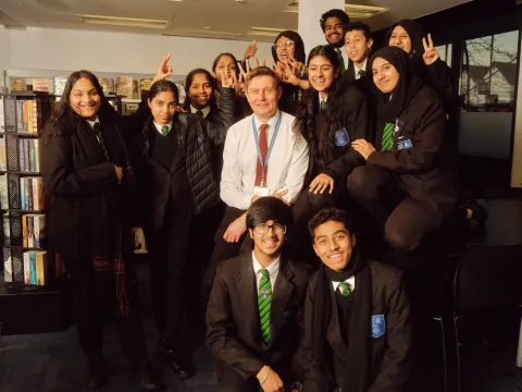 Featherstone High School teacher with students
