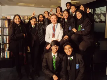 Featherstone High School teacher with students